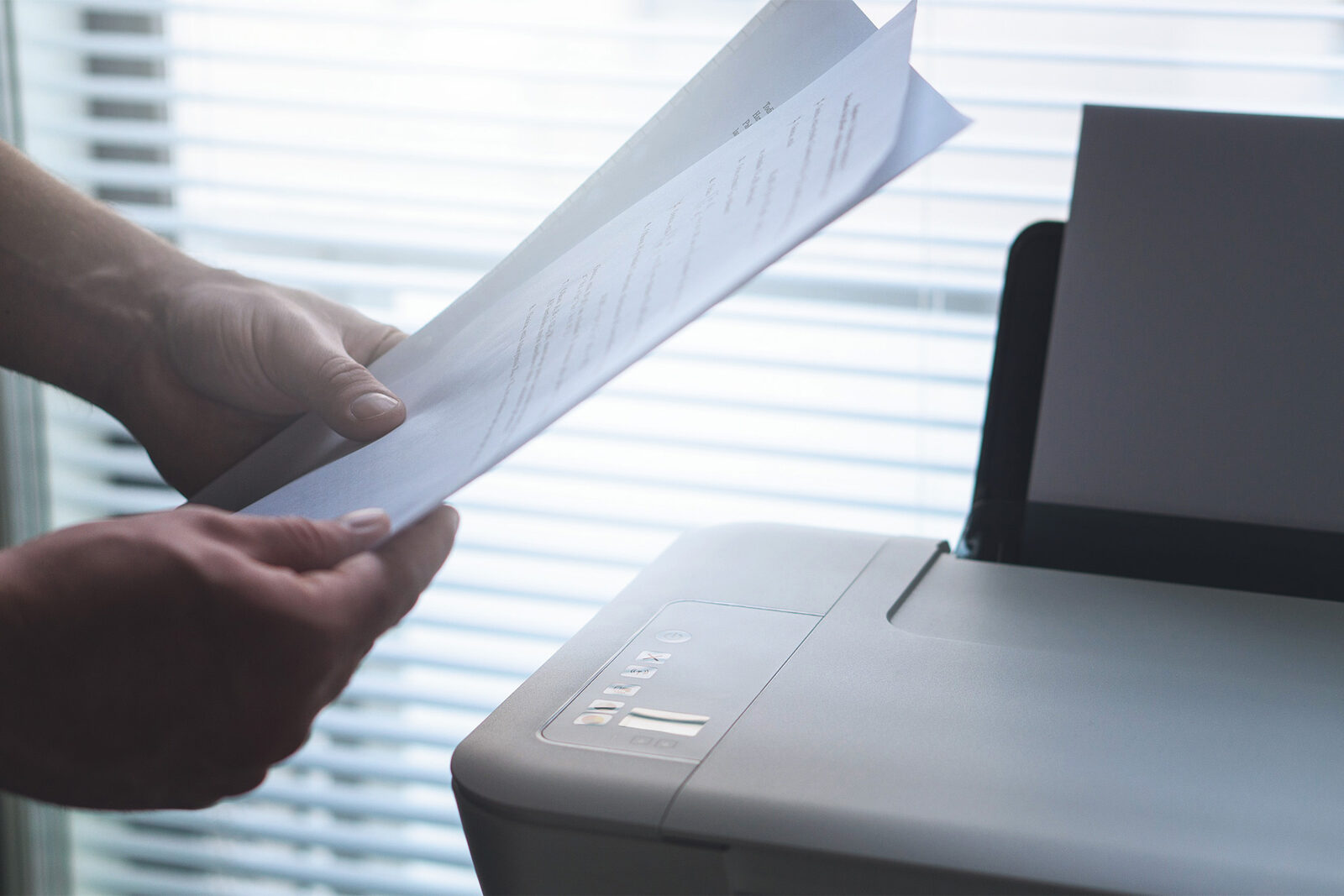 Office documents and compliance paperwork on a desk.